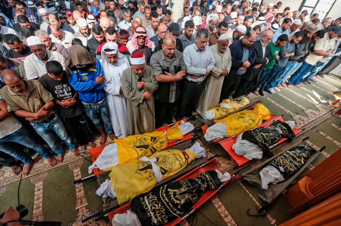 Crowds mourn a family killed overnight in an Israeli airstrike in Deir al-Balah.