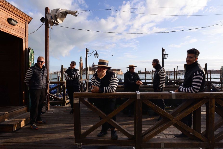 A group of Gondoliers are seen on a pier in Venice, after the city suffered its highest tide in 50 years.