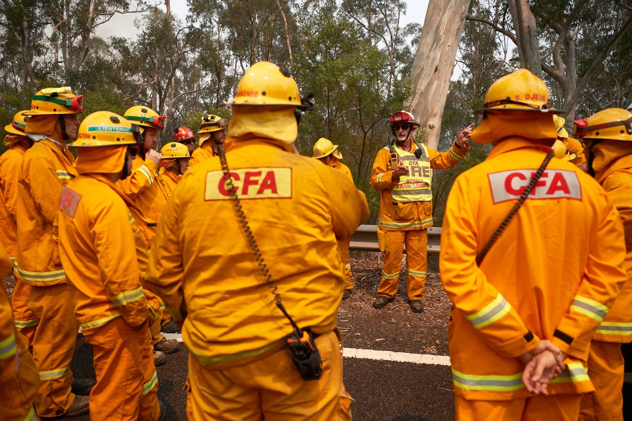 Firefighters organize their crews prior to working on controlled back burns in Sydney on November 14.