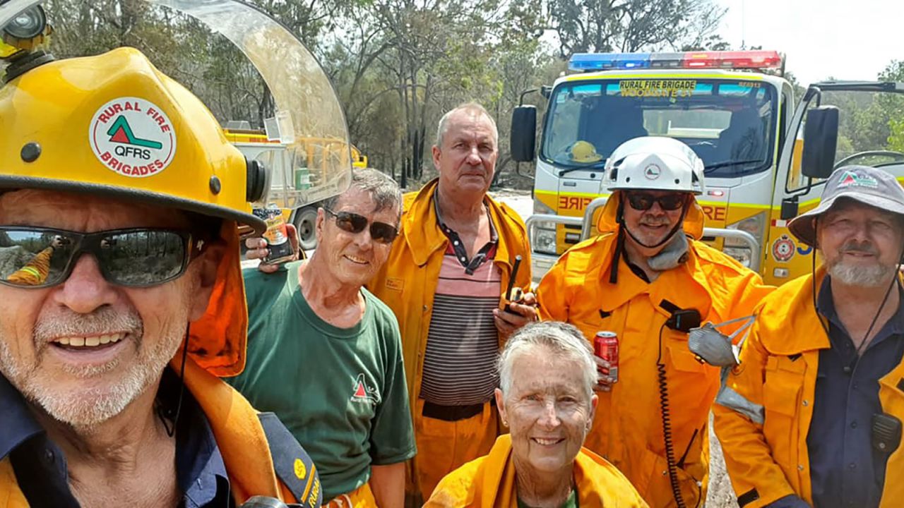 John Foster (left) and a team of volunteers from the Woodgate Rural Fire Brigade are battling a bushfire in Queensland. 