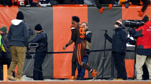 Garrett walks off of the field after being ejected.