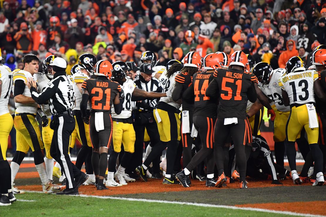 Steelers and Browns fight in the end zone near the end of the game.