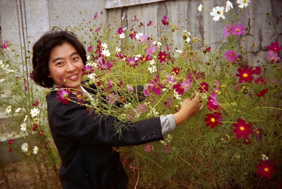 People posing with flowers is a recurring theme among the archive's 850,000 photos.