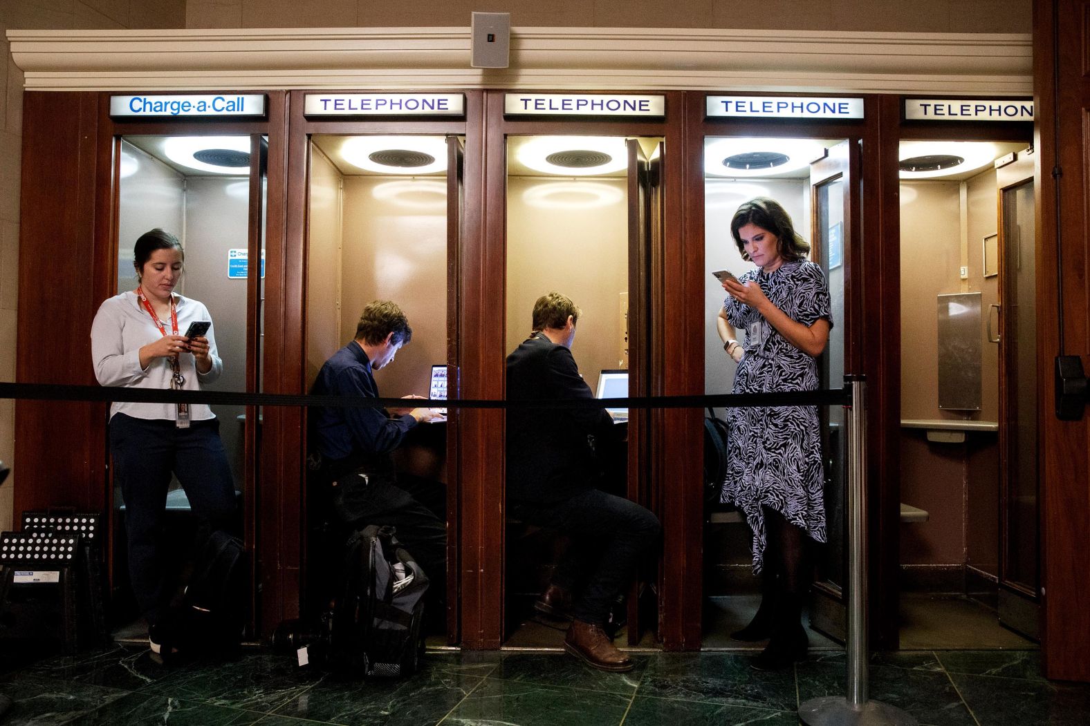 Journalists file from Capitol Hill on November 13, the day of the first public hearing.