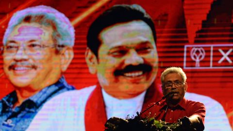 Sri Lankan presidential candidate Gotabaya Rajapaksa speaks during a campaign rally November 13, 2019, in front of a giant screen showing his brother, former president Mahinda Rajapaksa. 