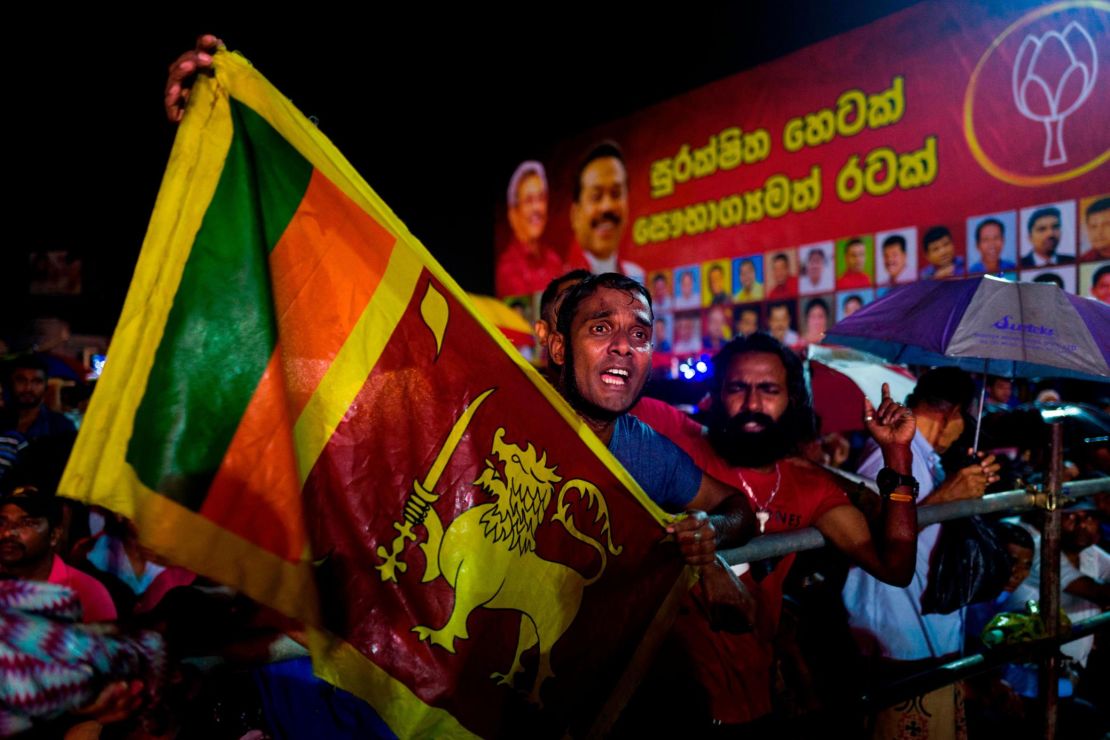 Supporters of Sri Lanka Podujana Peramuna (SLPP) party presidential candidate Gotabhaya Rajapaksa shout slogans during a campaign rally in Homagama on November 13, 2019, ahead of the November 16 presidential election.