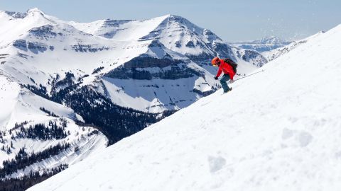 Big Sky Montana skier with Rocky on the background.