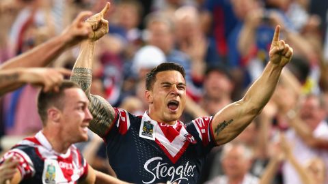 Williams celebrates winning the NRL grand final match with the Roosters in 2013. 