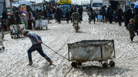 A boy pulls a cart in al-Hol camp which houses thousands of relatives of ISIS group members in northeastern Syria.