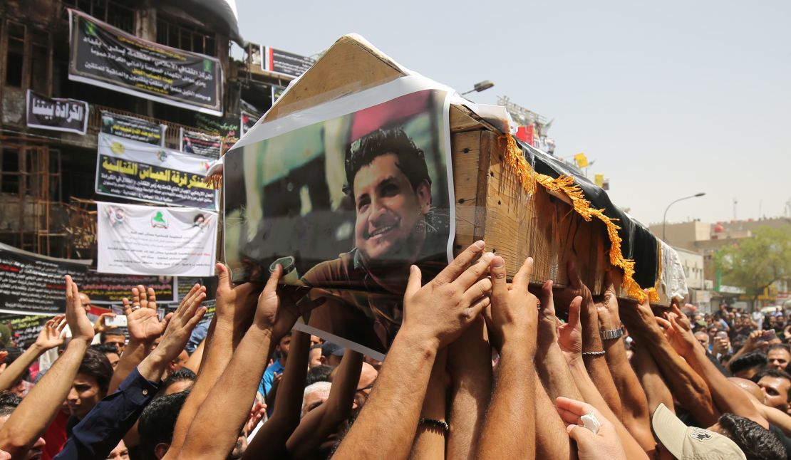 Mourners carry the coffin of an Iraqi man who was among nearly 300 people killed in an ISIS suicide bombing that ripped through Baghdad's busy shopping district of Karrada in July 2016.