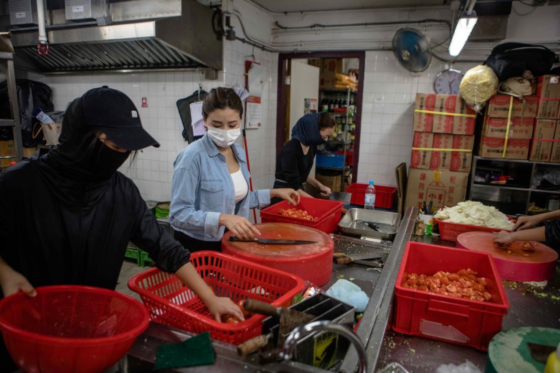 People prepare food for protesters at Hong Kong Polytechnic University (PolyU) on November 15, 2019.