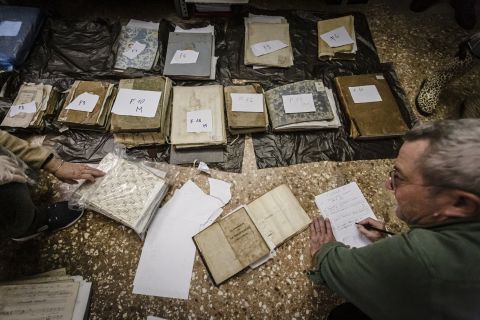 Volunteers treat damaged music sheets from the historical archive of the Conservatorio Benedetto Marcello, on Friday, November 15. Important music sheets have been damaged by unexpected flooding throughout the city of Venice.