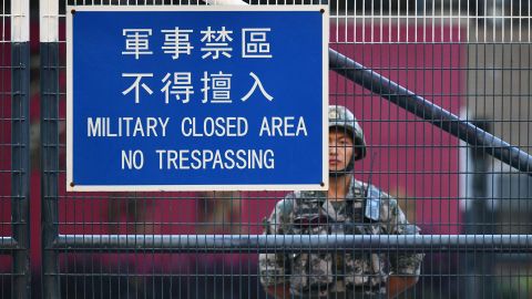A member of Chinas People's Liberation Army (PLA) stands guard inside Osborn Barracks in Kowloon Tong in Hong Kong on November 16, 2019.