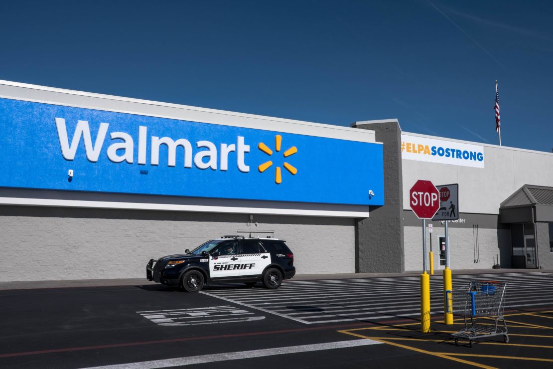 A sheriff's vehicle drives past the Walmart store in Cielo Vista a day after its official reopening on November 14.