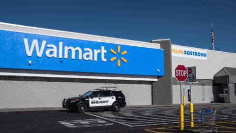 A sheriff's vehicle drives past the Walmart store in Cielo Vista a day after its official reopening on November 14.