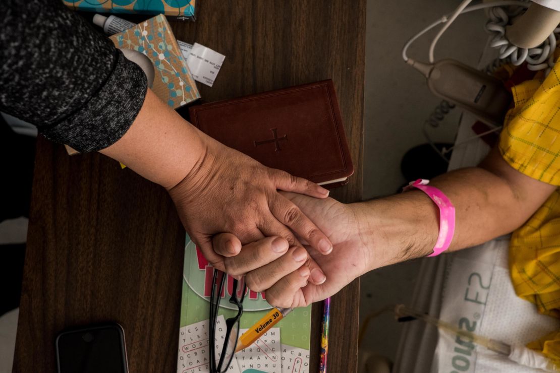 Two weeks passed before Oliva Rodriguez Mariscal (left) and her husband Mario De Alba Montes reunited after paramedics took them to a hospital in El Paso. The couple and their daughter were shot inside Walmart.