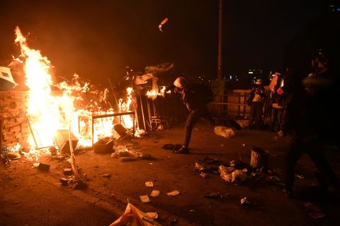 A protester throws a Molotov cocktail at police on November 17. 
