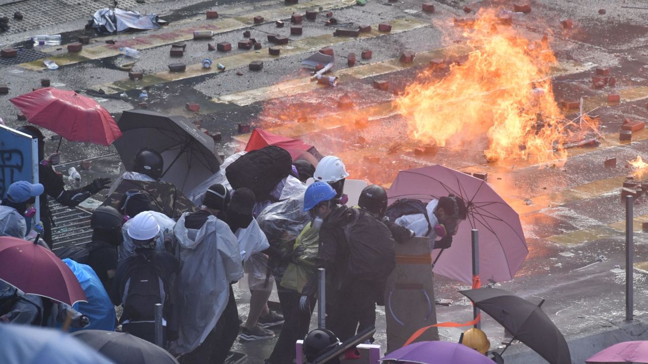 Police use water cannon outside the Hong Kong Polytechnic University to disperse protesters in Hong Kong on Sunday,  November 17, 2019.