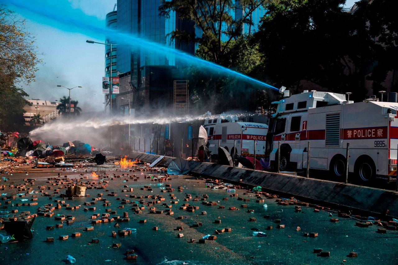 Police use a water cannon outside the Hong Kong Polytechnic University.