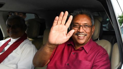 Sri Lanka's President-elect Gotabaya Rajapaksa waves at supporters as he leaves the election commission office in Colombo on November 17, 2019. 
