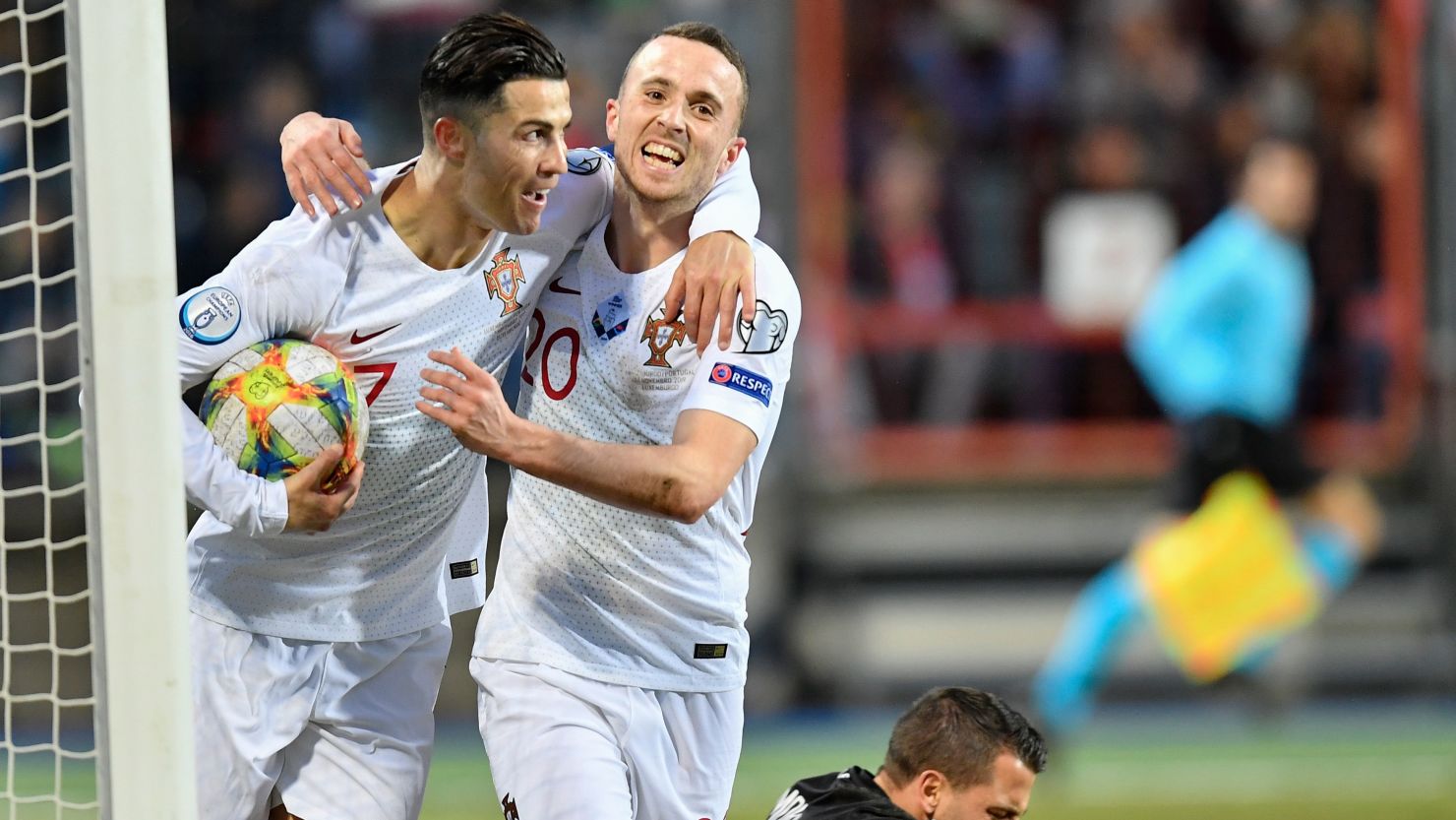 Cristiano Ronaldo (left) celebrates as he scores goal No. 99 for Portgual.