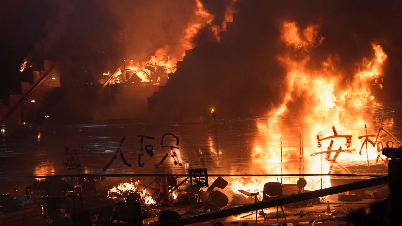 A massive fire burns at the steps leading to Hong Kong Polytechnic University, as clashes continued to rage early Monday.