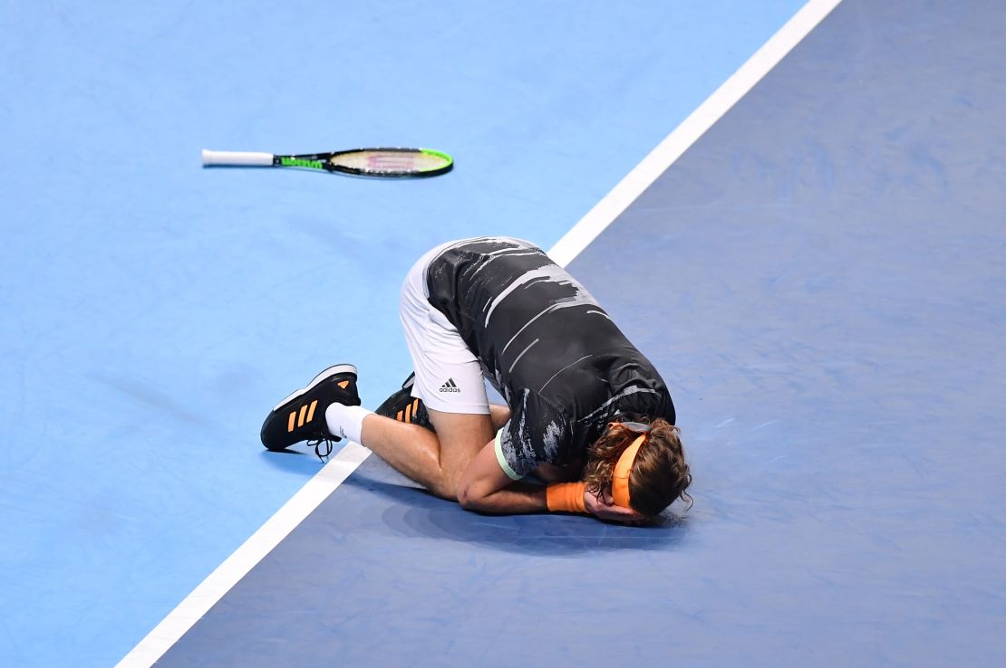 Stefanos Tsitsipas sinks to the ground after match point at the ATP Finals. 