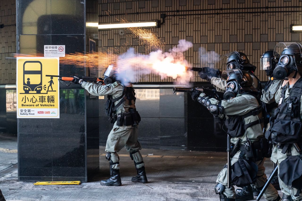 Riot police fire tear gas and rubber bullets as protesters attempt to leave Hong Kong Poytechnic University on November 18.