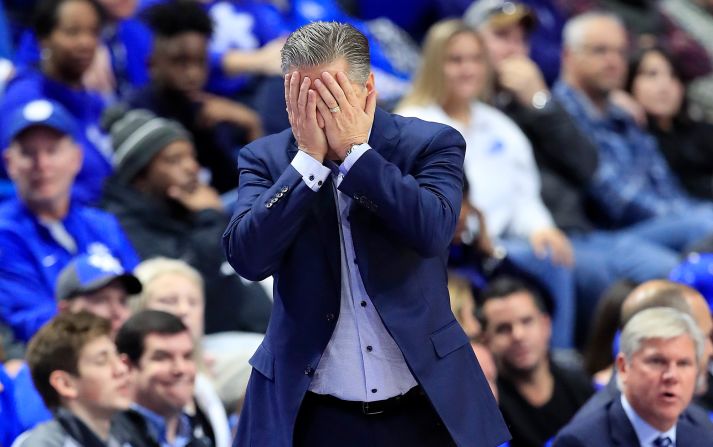 Kentucky Wildcats head coach John Calipari puts his head in his hands in reaction to a mistake by his team during the first half of an NCAA basketball game against Evansville in Lexington, Kentucky, on Tuesday, November 12. The number one ranked Wildcats lost the game to unranked Evansville.