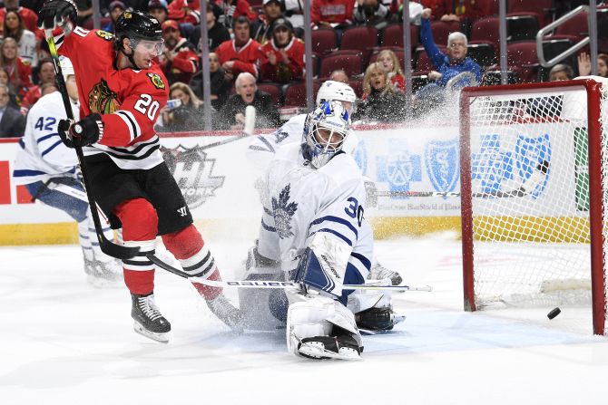 Brandon Saad of the Chicago Blackhawks scores a goal against Toronto Maple Leafs goaltender Michael Hutchinson during the third period of their NHL game in Chicago on Sunday, November 10.