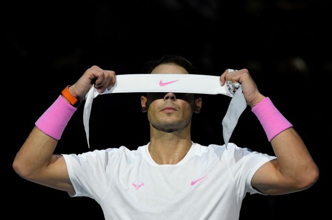 Rafael Nadal prepares to tie a headband around his head prior to his ATP Finals group stage match against Stefanos Tsitsipas in London, England, on Friday, November 15.