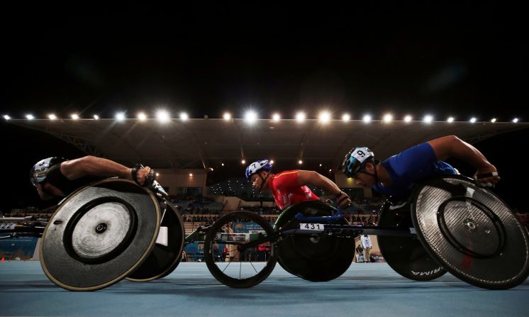 China's Yungiang Dai, center, and Thailand's Putharet Khongrak, right, compete in the men's 5000m T54 final at the World Para Athletics Championships in Dubai on Wednesday, November 13.