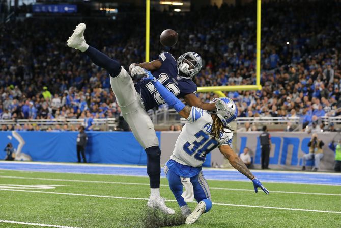 Dallas Cowboys receiver Michael Gallup makes a catch over Detroit Lions defensive back Mike Ford during the second quarter of their NFL game at Ford Field in Detroit on Sunday, November 17.