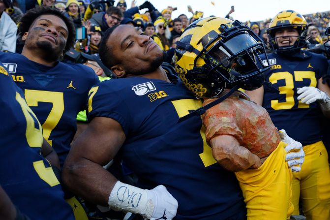 Michigan Wolverines wide receiver Tarik Black celebrates with the Paul Bunyan trophy after defeating in-state rival Michigan State in a college football game in Ann Arbor, Michigan, on Saturday, November 16. <a href="index.php?page=&url=http%3A%2F%2Fwww.cnn.com%2F2019%2F11%2F11%2Fsport%2Fgallery%2Fwhat-a-shot-1110%2Findex.html" target="_blank">See 35 amazing sports photos from last week</a>
