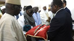 Senegal President Macky Sall (R) present the sword El Hadj Omar Tall during a ceremony with French Prime Minister Edouard Philippe at the Palace of the Republic in Dakar, Senegal, on Novamber 17, 2019. - French Prime Minister Edouard Philippe returns to President Macky Sall the sword of a Senegalese religious chief of XIX century, so far exposed at the museum of Invalides in Paris. (Photo by SEYLLOU / AFP) (Photo by SEYLLOU/AFP /AFP via Getty Images)