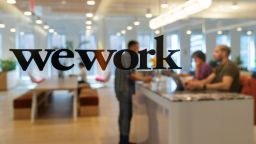 Signage is seen at the entrance of the WeWork Cos Inc. 85 Broad Street offices in the Manhattan borough of New York, U.S., on Wednesday, May 22, 2019. WeWork has become the biggest private office tenant in London, Manhattan and Washington on its way to 425 office locations in 36 countries overall. Photographer: David 'Dee' Delgado/Bloomberg via Getty Images