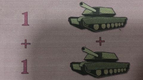 A schoolbook shows how tanks were used in an arithmetic lesson.