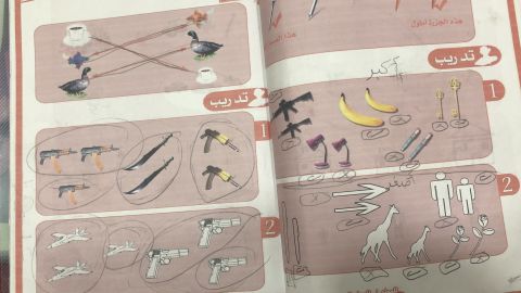 A child's textbook mixes weapons in with bananas and pens as items to count.