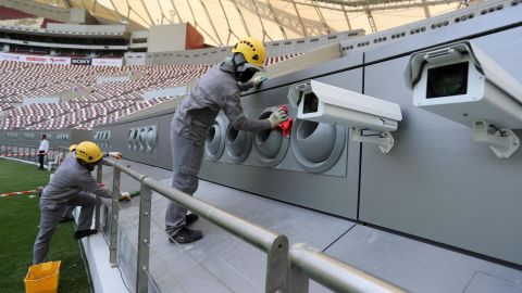 Workers cleaning the cooling system at the Khalifa International Stadium in Doha.