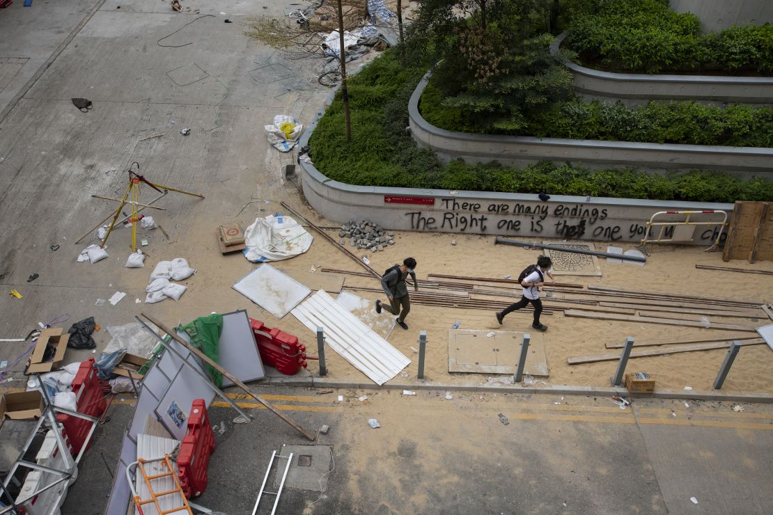 Protesters are seen running through the center of the PolyU campus.