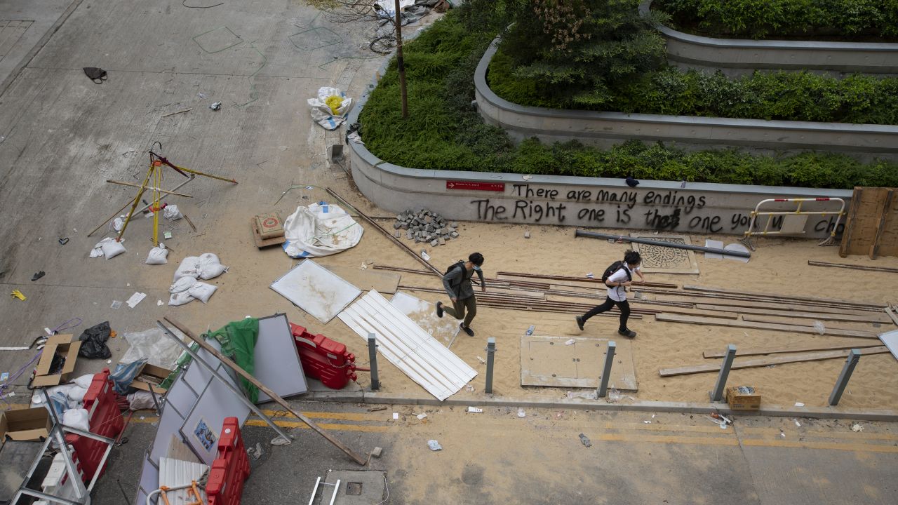 Protesters are seen running through the center of the PolyU campus.