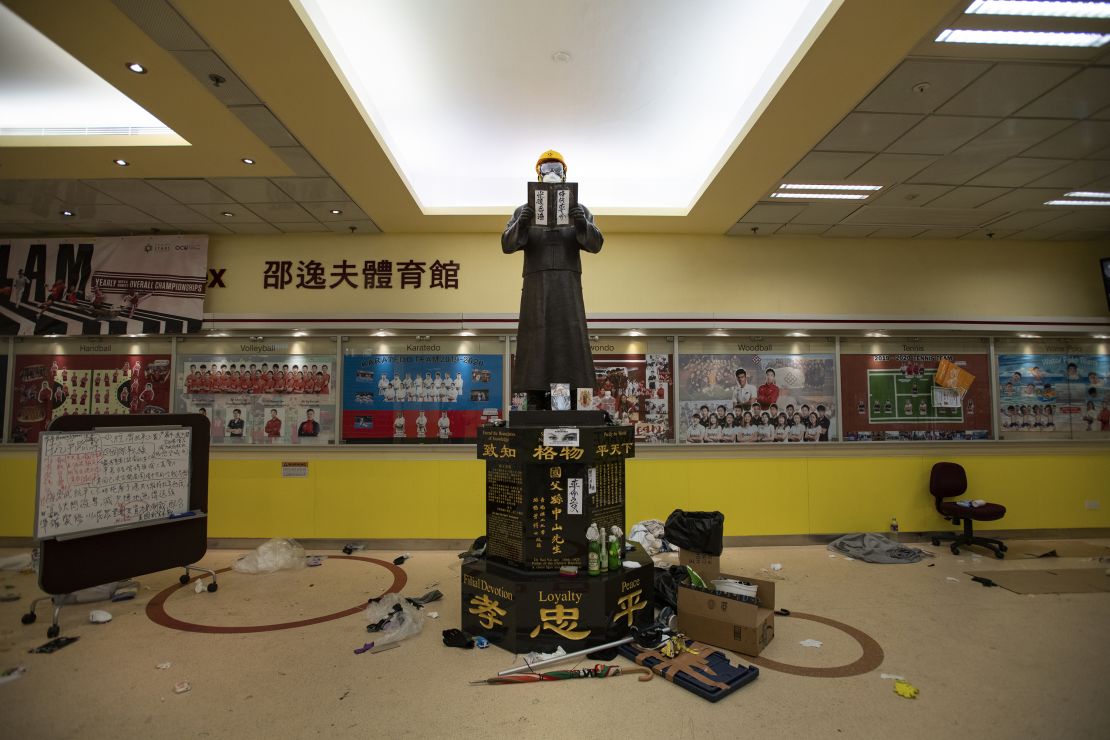 A statue near the entrance to the canteen and gymnasium is seen decked out in attire typical of Hong Kong's protesters.