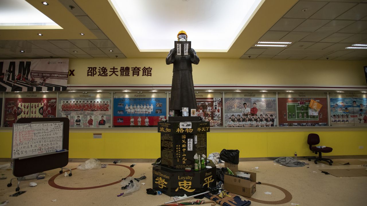 A statue near the entrance to the canteen and gymnasium is seen decked out in attire typical of Hong Kong's protesters.