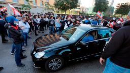 Lebanese protesters block the road before a businessman's vehicle in the capital Beirut's downtown district near parliament headquarters on November 19, 2019. - An unprecedented protest movement against the ruling elite entered its second month with the country in the grip of political and economic turmoil. The leaderless pan-sectarian movement has swept the Mediterranean country since October 17, prompting the resignation of Prime Minister Saad Hariri's government. (Photo by JOSEPH EID / AFP) (Photo by JOSEPH EID/AFP via Getty Images)