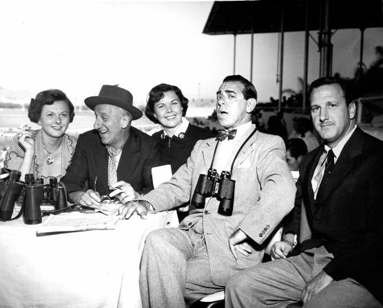Jimmy Durante (second from left) and Eddie Cantor (second from right) pictured at Del Mar racecourse with friends. Scroll through the gallery to see more images of Hollywood stars at the races.