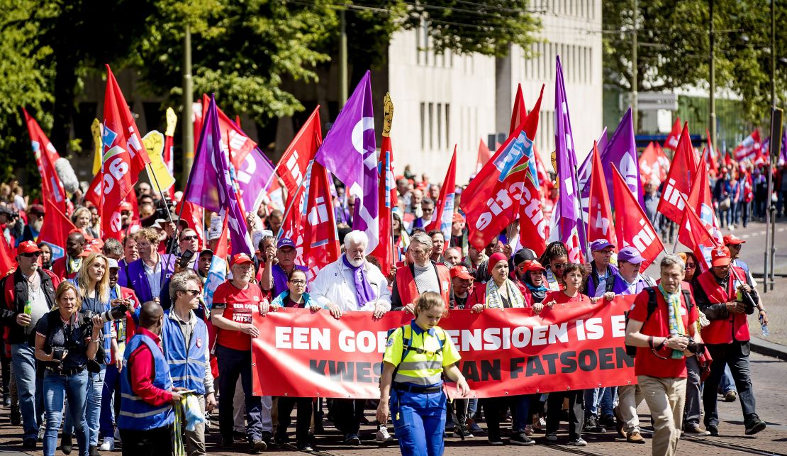 Union activists rally in The Hague in May with signs that read "a good pension is a matter of decency."