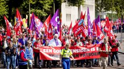 Trade Union activists shout slogans as they march with banners - "a good pension is a matter of decency" -  and flags in The Hague on May 29, 2019, in a call to strike for better pensions. - Netherland's trade unions CNV, FNV and VCP have called for a large-scale strike to reinforce their pension wishes. (Photo by Koen van Weel / ANP / AFP) / Netherlands OUT        (Photo credit should read KOEN VAN WEEL/AFP via Getty Images)