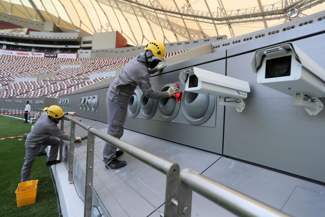 Workers cleaning the cooling system at the Khalifa International Stadium in Doha after it was refurbished ahead of the Qatar 2022 FIFA World Cup.