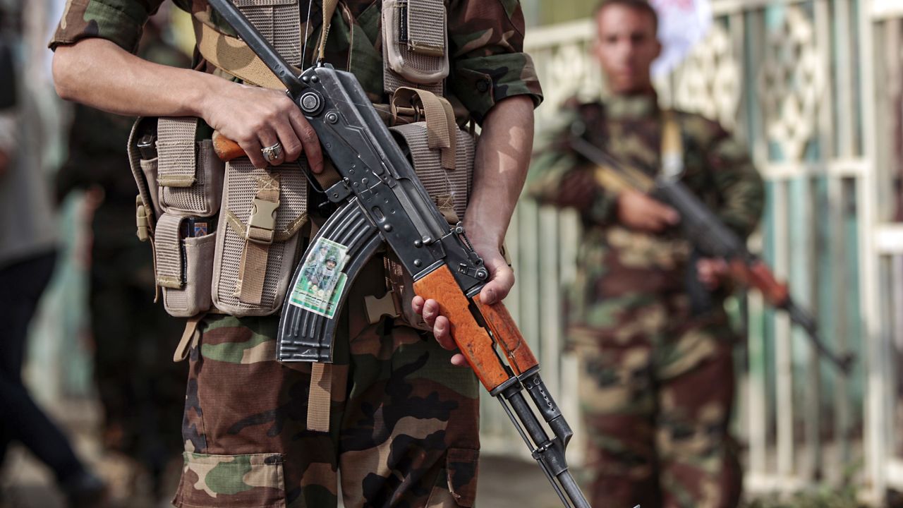 A fighter loyal to Yemen's Huthi rebels holds a Kalashnikov assault rifle as he stands guard during a rally, September 10, 2019.