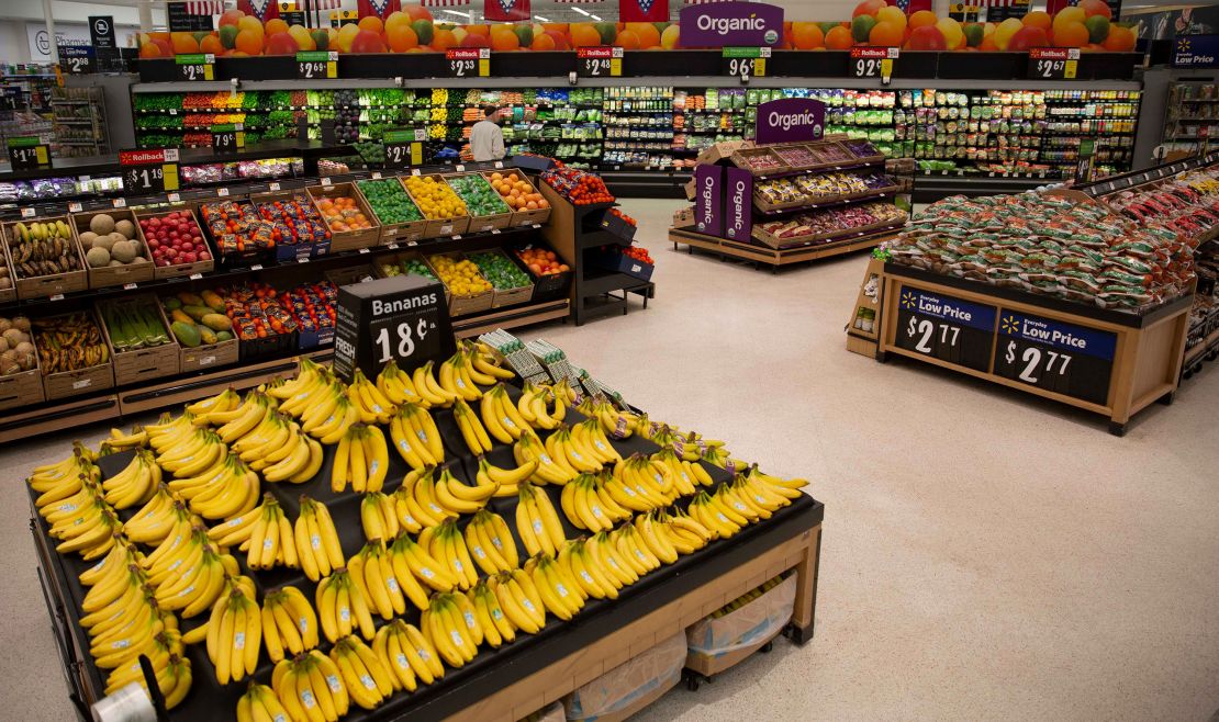 Walmart is adding new signs, wider aisles and lowering bin heights to create an "open market feel."